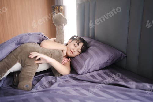 Preview: asian children girl are sleep on bed at home, little young cute daughter having bedtime to relax