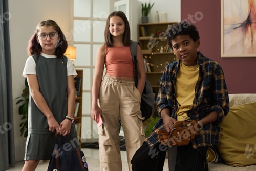 Preview: Group of Kids Holding Backpacks Standing in Living Room
