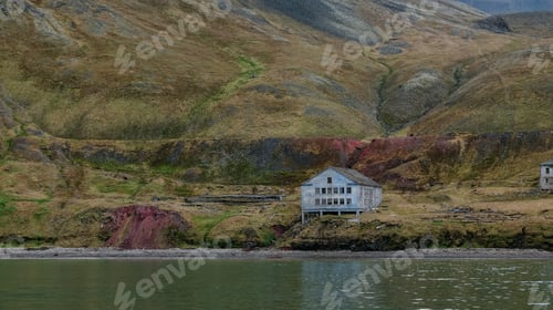 Preview: Exploring Grumant in Svalbard with historic buildings along the serene fjord coastline