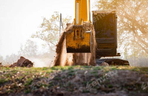 Preview: Backhoe working by digging soil at construction site. Crawler excavator digging on demolition site.