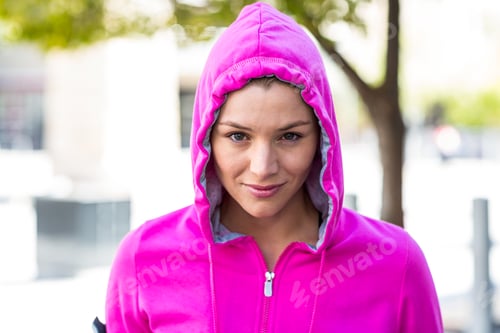 Preview: A woman wearing a pink jacket on a sunny day