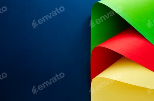 Preview: Vibrant red, yellow and green aper shapes contrasted against a blue background.