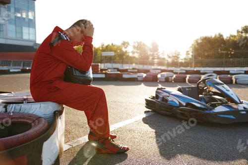 Preview: Man In Red Suit Sits Head In Hands