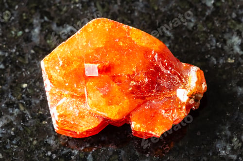 Preview: sample of raw vanadinite crystal on black granite