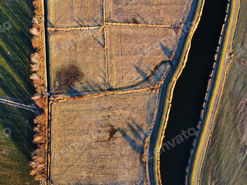 Preview: Drone shot of a river in a field