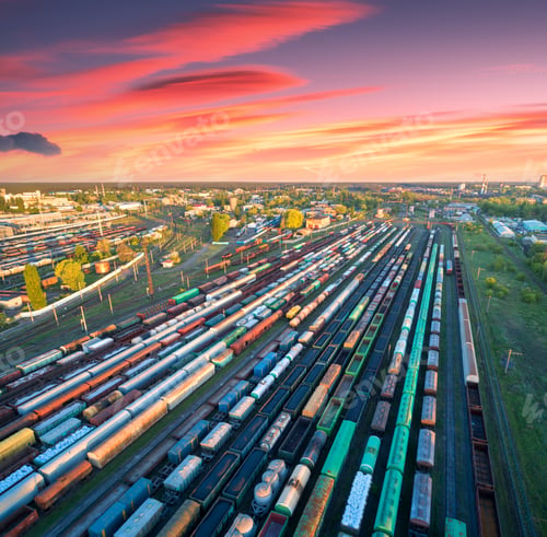 Preview: Aerial view of freight trains on railway station at sunset