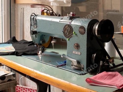 Preview: Antique sewing machine and seamstress workspace