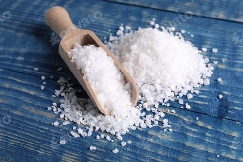 Preview: Natural salt and scoop on blue wooden table, closeup
