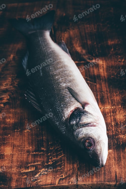 Preview: Fresh Sea Bass on Cutting Board