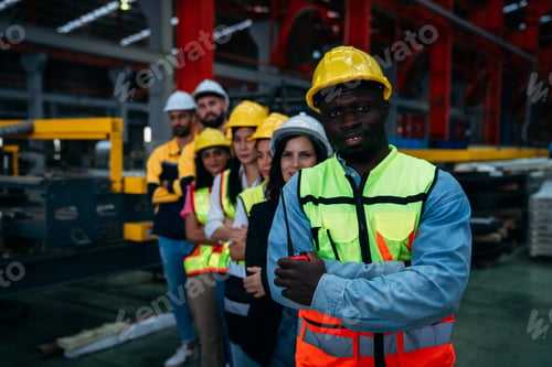 Preview: Portrait of industrial worker inspecting and check up machine at factory machines.
