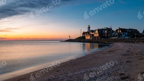 Preview: Urk Flevoland Netherlands sunset at the lighthouse and harbor of Urk Holland