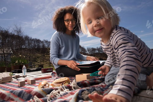 Preview: Mother and son on picnic blanket
