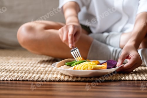 Preview: Closeup image of a woman eating vegetables, Vegan, Clean food, dieting concept