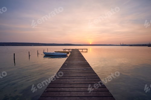 Preview: Landscape photo of a jetty and boats on lake at sunset in Varna, Bulgaria.