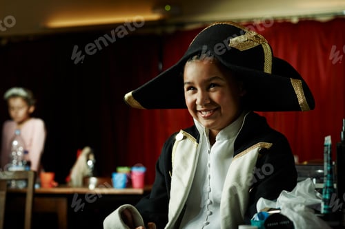 Preview: Young child enjoying a playful moment in a pirate costume
