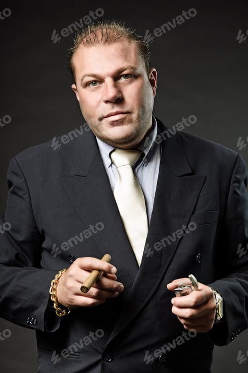 Preview: Gangster Mafia Man In Suit With Tie Looking Tough Isolated On Dark Background
