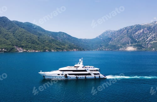 Preview: View on the luxury yacht in Montenegro. Blue sea water background from air.