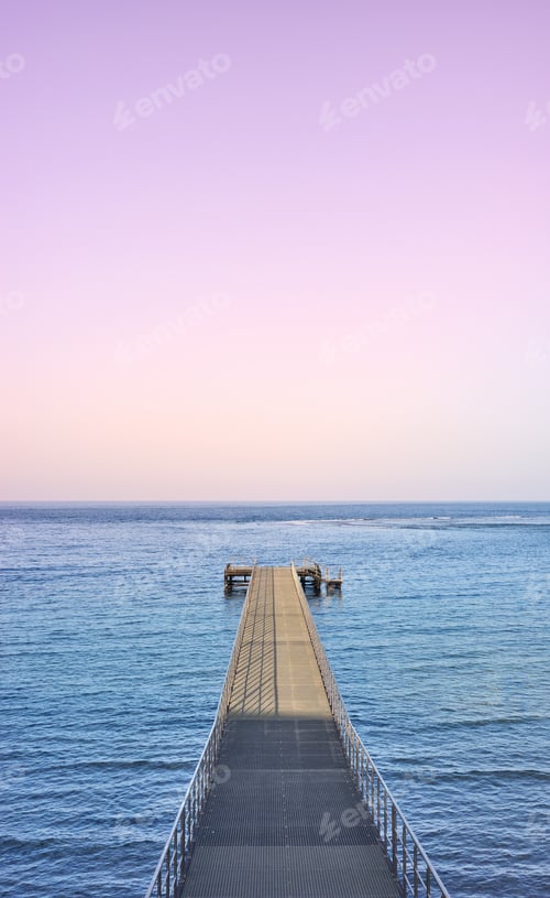 Preview: Empty pier at purple sunset.