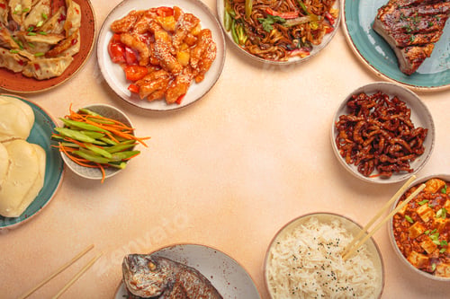 Preview: Assorted traditional chinese dishes top view on a table: kung pal chicken, sweet and sour pork