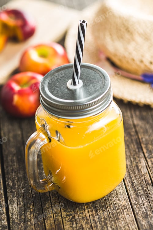 Preview: Fresh orange juice in glass jug.