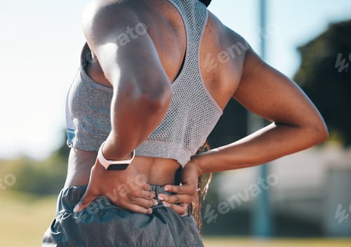 Preview: Back pain, fitness and athlete with injury problem in a stadium due to outdoor exercise, training o