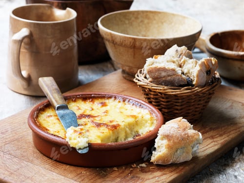 Preview: Baked cheese in terracotta dish