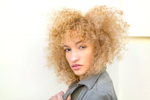 Preview: portrait young latin woman looking serious at camera