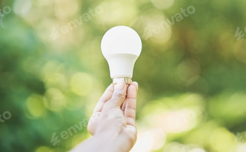 Preview: Outdoor, renewable energy and hand with light bulb, green and power development for positive impact