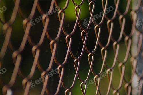 Preview: close up view of detail of wire and chain-link fence