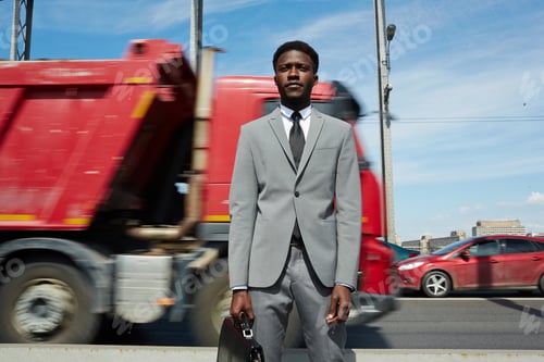 Preview: Businessman by highway
