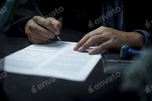 Preview: businessman agree to make deal signing document, sale contract or legal transaction contract at desk