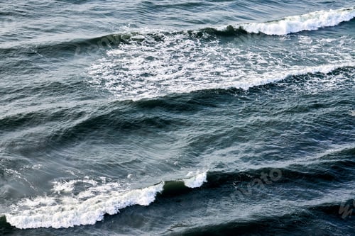 Preview: Deep blue sea waters splashing with foamy waves, dark blue wavy ocean water surface, copy space