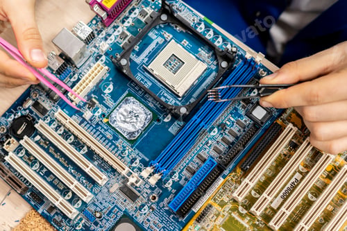 Preview: technician install transistor on a circuit board b