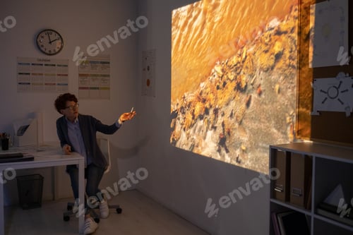 Preview: Young teacher pointing at polluted water during video presentation