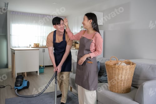 Preview: Asian couple cleaning home together
