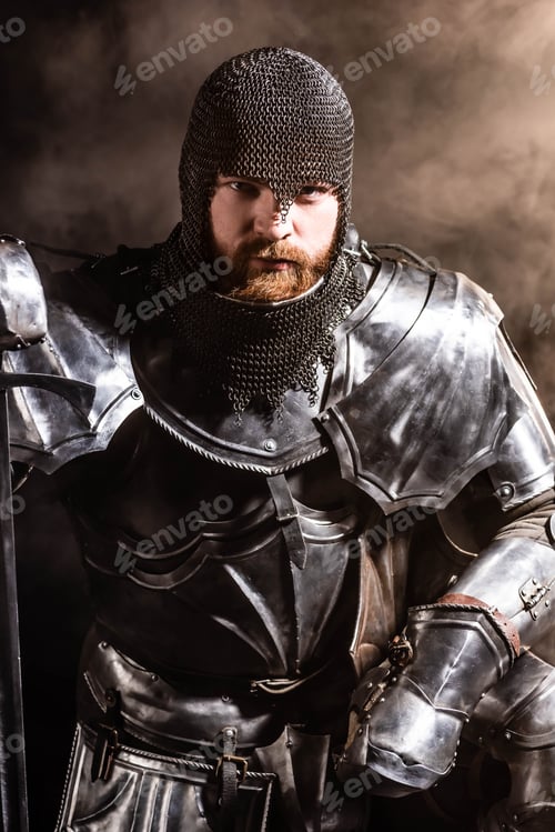 Preview: handsome knight in armor holding sword on black background