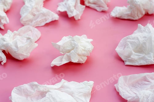 Preview: Crumpled tissue paper. Facial tissue on pink background.