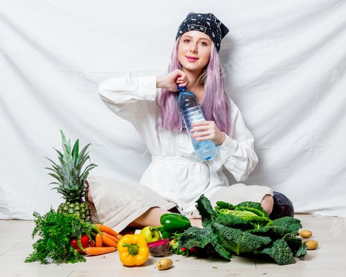 Preview: Beautiful caucasian vegan woman with vegetables