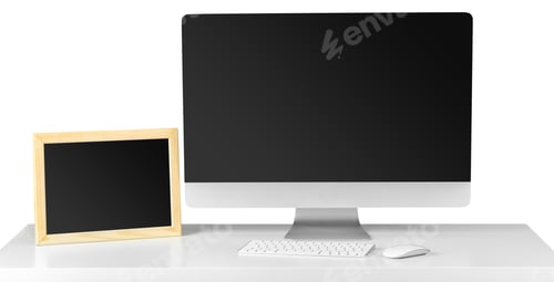 Preview: Workspace setup with a computer and a chalkboard on a white desk during daytime