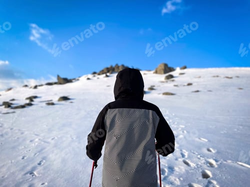 Preview: Winter Hike Up Snow-Covered Mountain Under Sunny Sky