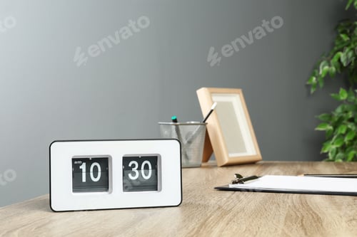 Preview: Stylish flip clock on table in office, space for text. Time management