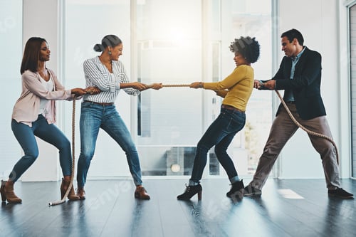 Preview: Shot of a group of businesspeople pulling on a rope during tug of war in an office