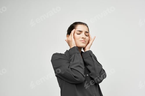 Preview: woman in black shirt headache discontent trouble light background