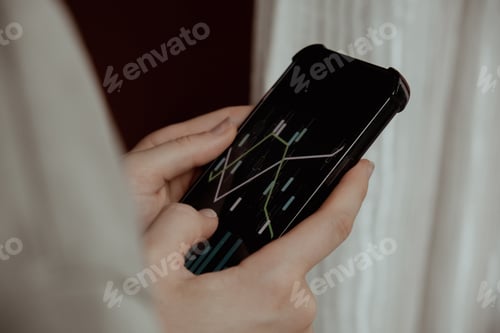 Preview: Female hands holding phone, checking Stock market graph for tranding and investment in security