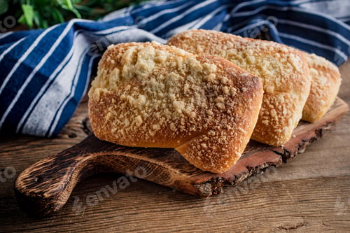Preview: Sweet buns with cheese on wooden table.