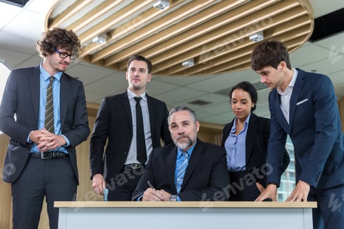 Preview: Diverse colleagues gather in brainstorm discuss statistics together.