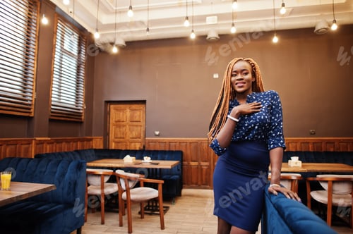 Preview: African woman in blue blouse