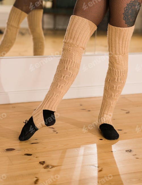 Preview: Close-up of dancing legs of ballerina wearing pointe on a dance hall. Ballet dancer and practice