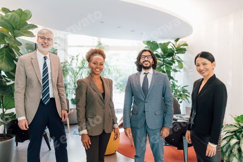 Preview: Italy, Portrait of smiling business people standing in creative studio