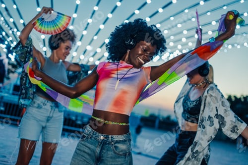 Preview: Friends listening music and dancing at silent disco party